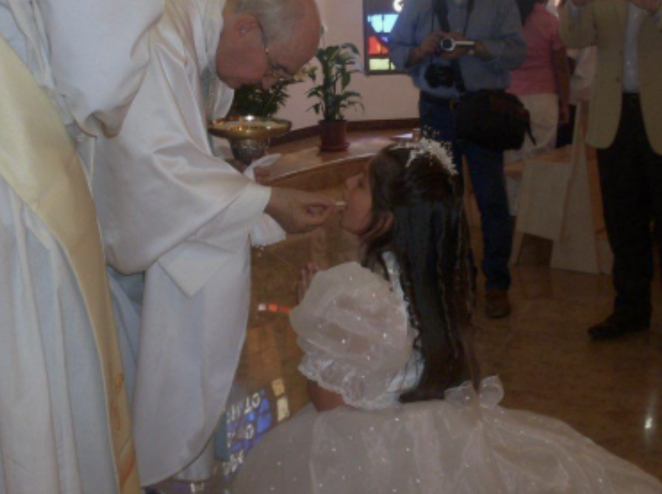 Stasia as a young girl at her first communion in Italy